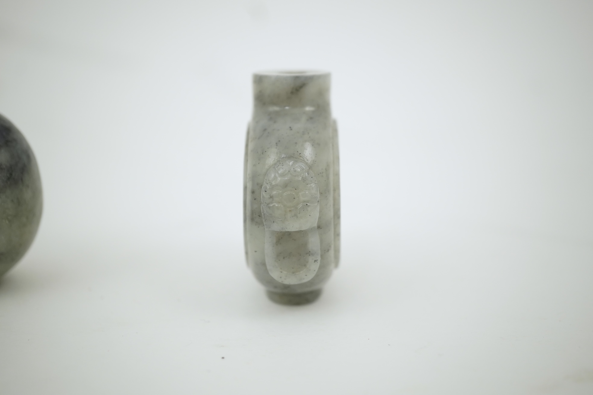 A collection of Chinese hard stone pieces comprising a cup, two snuff bottles, an elephant and pendant. Condition - fair/good